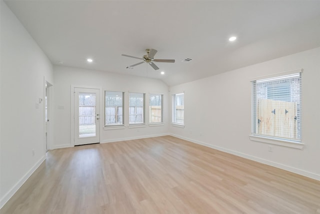 spare room with lofted ceiling, light hardwood / wood-style floors, and ceiling fan