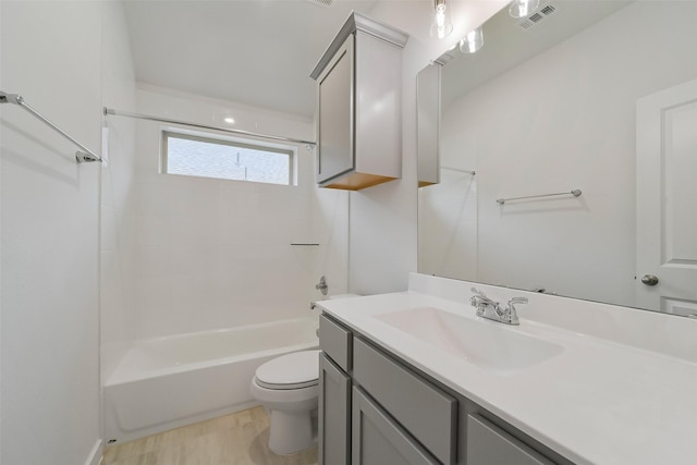 full bathroom with vanity, bathing tub / shower combination, and toilet