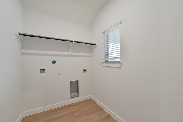 washroom with gas dryer hookup, wood-type flooring, hookup for an electric dryer, and hookup for a washing machine