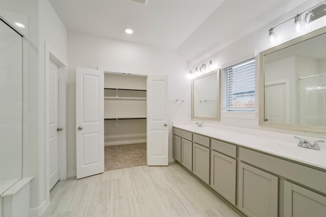 bathroom with vanity and an enclosed shower