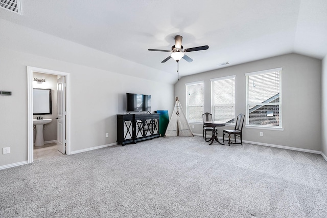 sitting room with carpet, ceiling fan, lofted ceiling, and sink