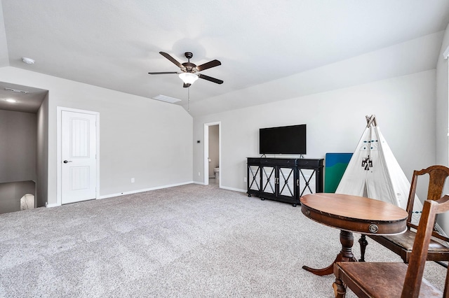 living area featuring ceiling fan, carpet, and vaulted ceiling