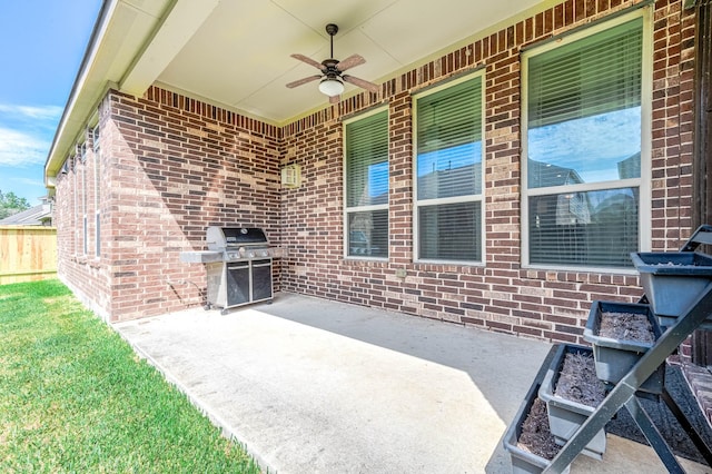 view of patio / terrace featuring a grill and ceiling fan