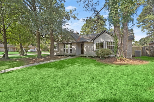 single story home featuring a front lawn