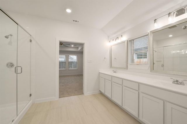 bathroom with ceiling fan, vanity, and an enclosed shower