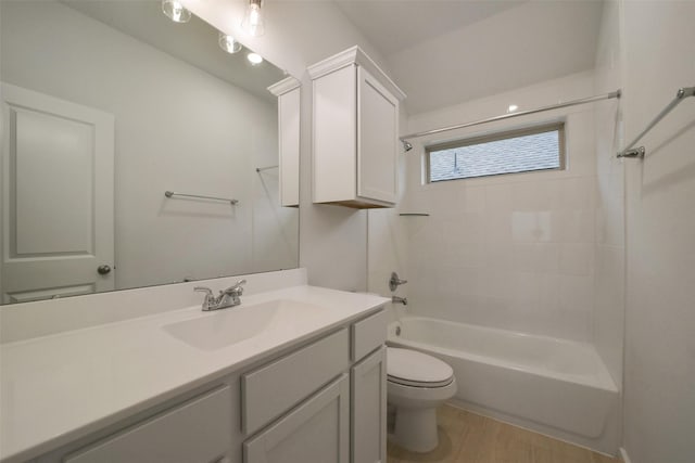 full bathroom with vanity, hardwood / wood-style flooring, toilet, and shower / bath combination