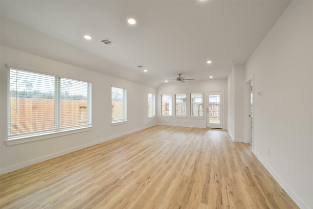 unfurnished living room featuring ceiling fan and light hardwood / wood-style flooring