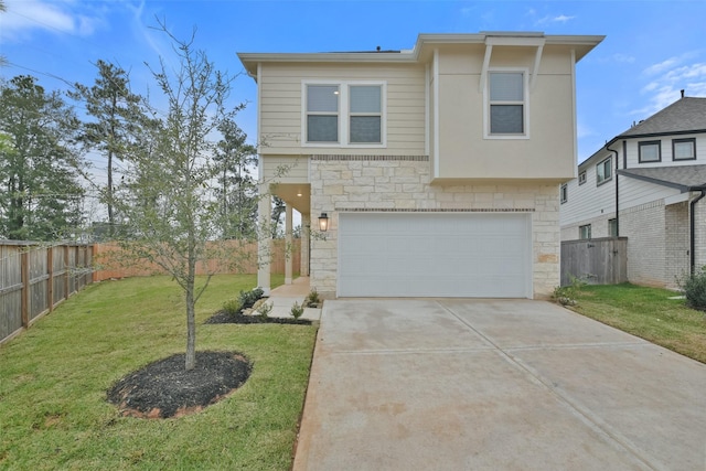 view of front of property with a garage and a front yard