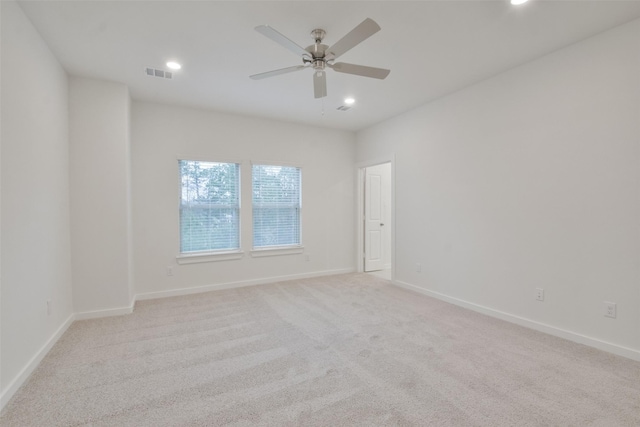 carpeted empty room featuring ceiling fan