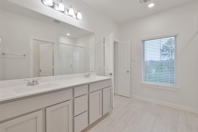 bathroom with vanity and walk in shower