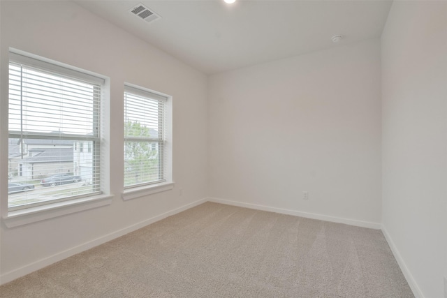 spare room featuring carpet flooring