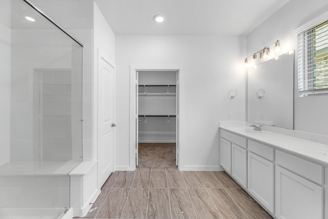 bathroom featuring vanity and walk in shower