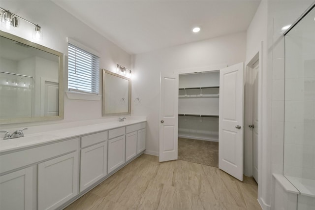 bathroom with vanity and walk in shower