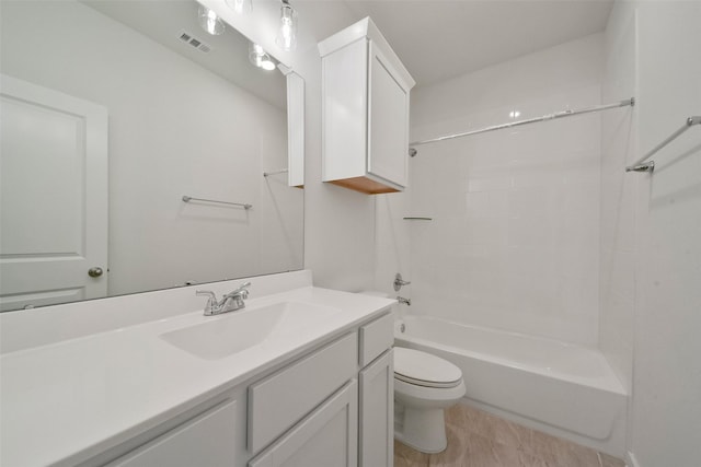 full bathroom with vanity, toilet, and washtub / shower combination