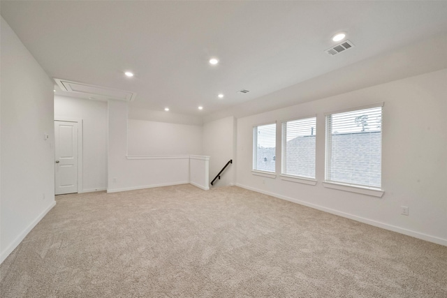 unfurnished room with light carpet