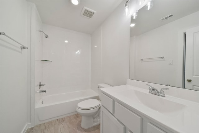 full bathroom featuring vanity, shower / tub combination, and toilet