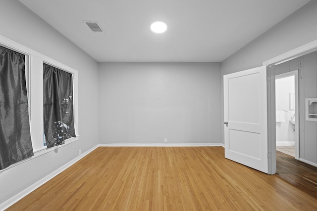 unfurnished room with light hardwood / wood-style floors