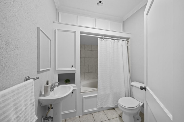 full bathroom with sink, tile patterned floors, shower / bath combination with curtain, toilet, and ornamental molding