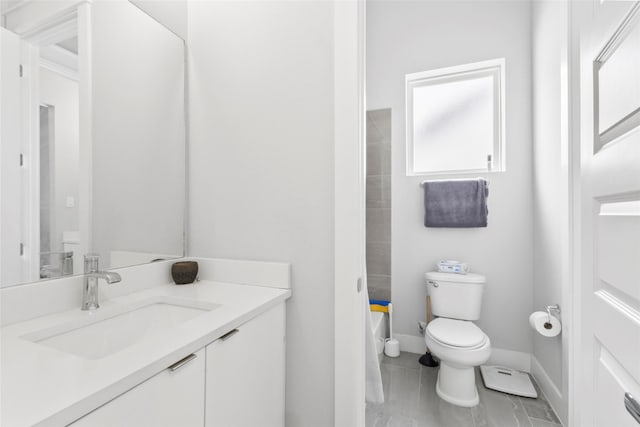 full bathroom featuring shower / tub combination, vanity, and toilet