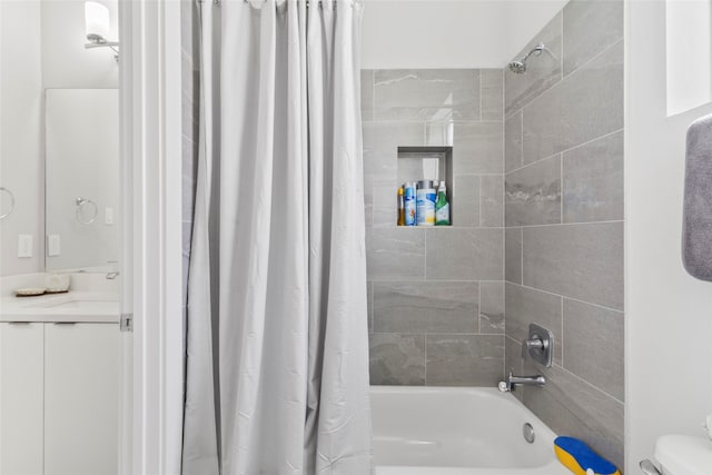 full bathroom featuring vanity, toilet, and shower / tub combo with curtain