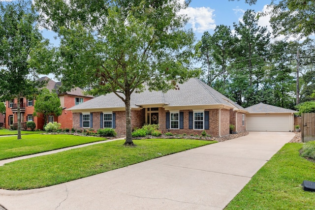 ranch-style home featuring a garage and a front yard