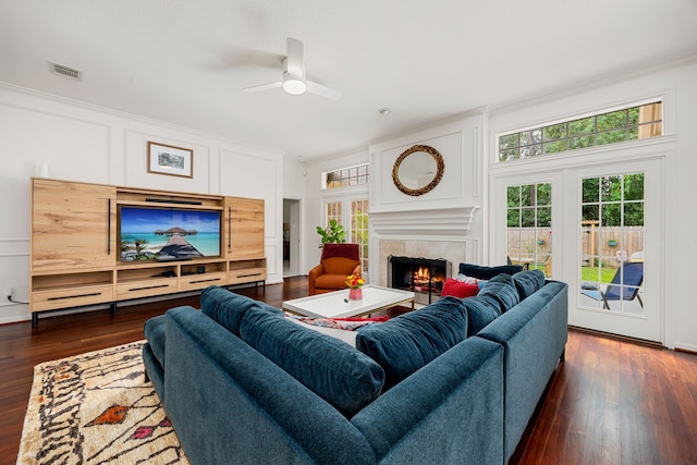 living room featuring french doors, dark hardwood / wood-style floors, ceiling fan, and crown molding