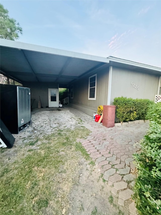 exterior space featuring a carport