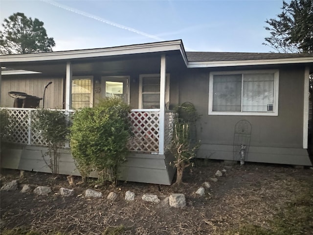 view of side of property featuring a porch