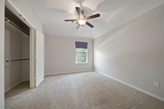 unfurnished bedroom featuring ceiling fan, carpet floors, and a closet