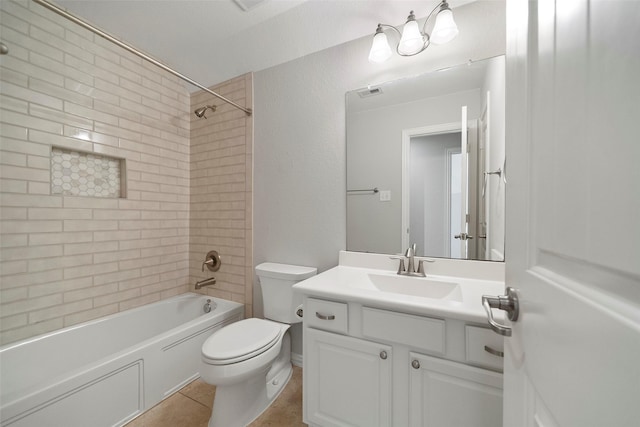 full bathroom featuring tile patterned floors, toilet, vanity, and tiled shower / bath