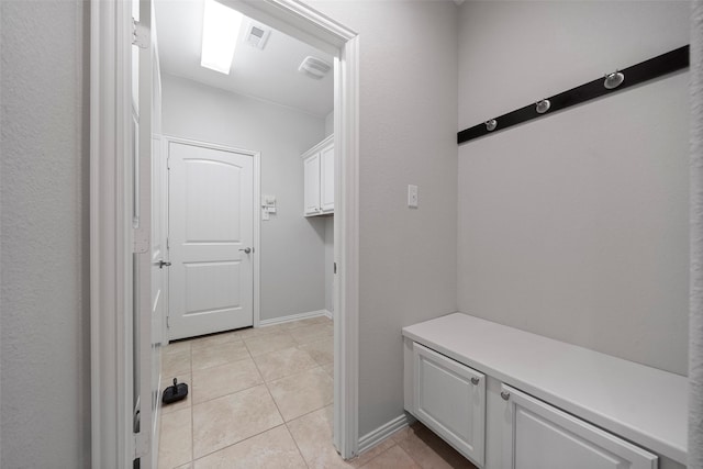 interior space with light tile patterned floors