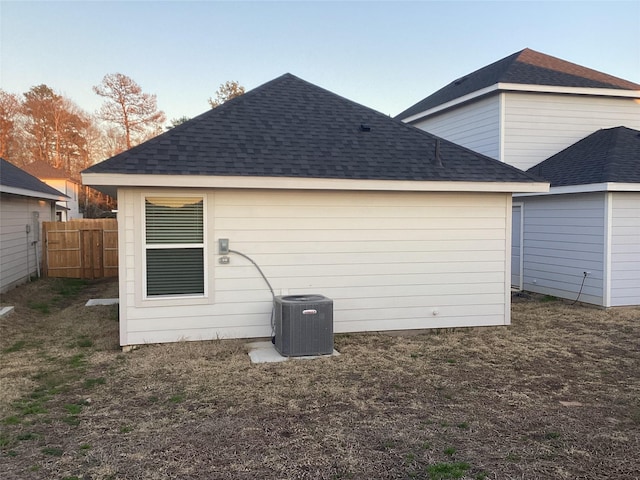 back of property with central air condition unit