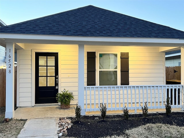 property entrance featuring covered porch