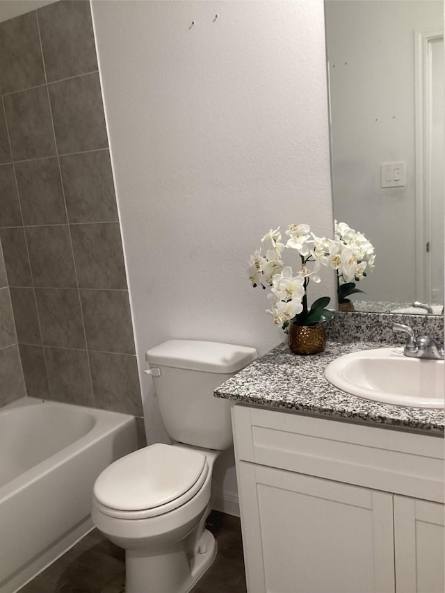 full bathroom with vanity, toilet, and shower / tub combination