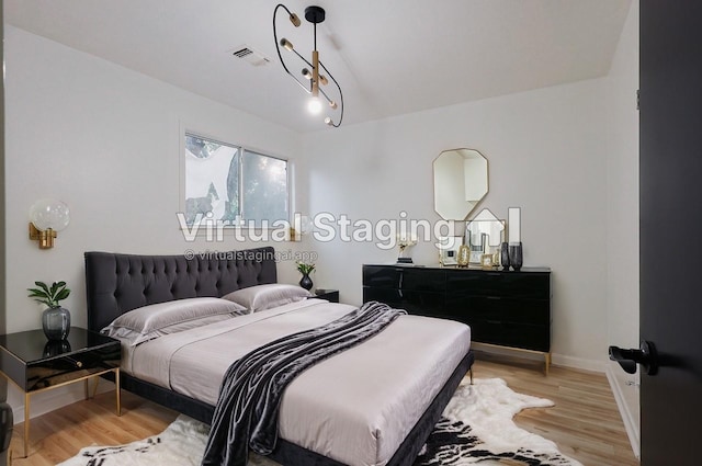 bedroom featuring light hardwood / wood-style floors