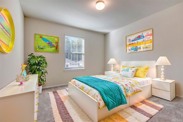 bedroom featuring light carpet