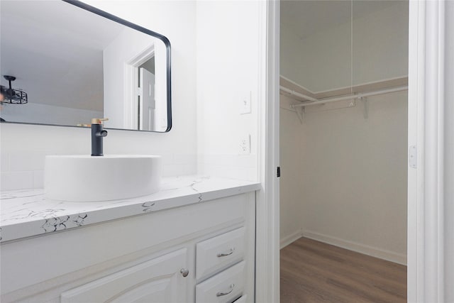 bathroom featuring vanity and hardwood / wood-style flooring