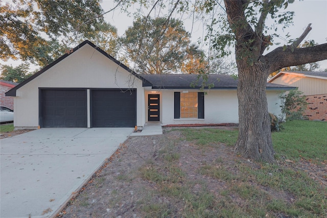 single story home featuring a garage