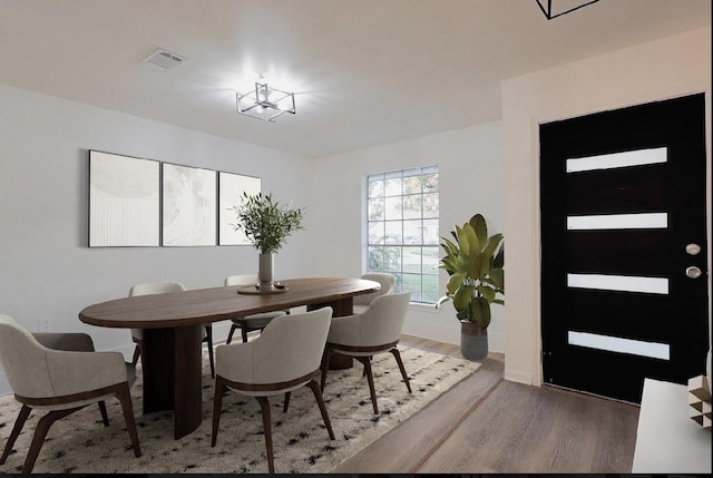 dining space featuring hardwood / wood-style floors