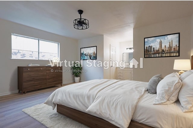 bedroom with hardwood / wood-style floors