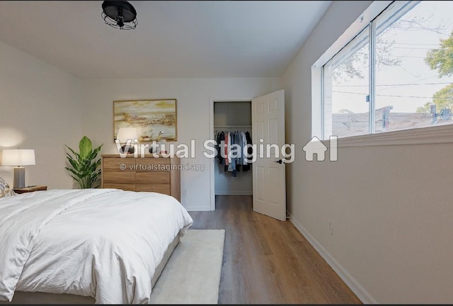 bedroom with wood-type flooring and a closet