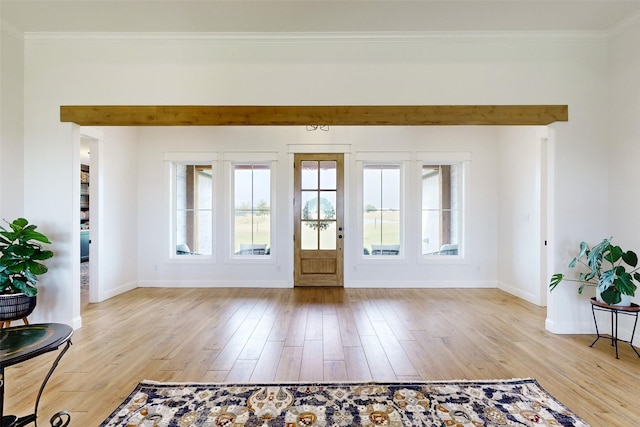 doorway featuring light hardwood / wood-style floors and crown molding