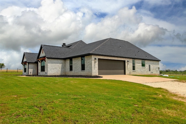 back of property with a lawn and a garage