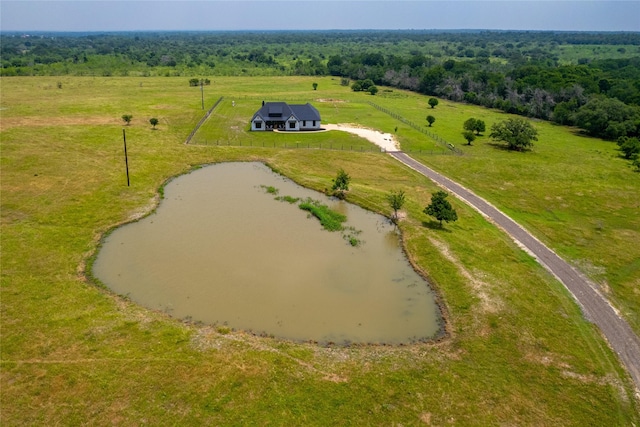 drone / aerial view featuring a rural view and a water view