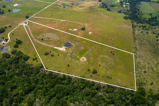 birds eye view of property featuring a rural view