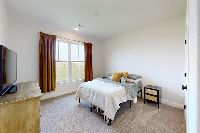 bedroom with light colored carpet