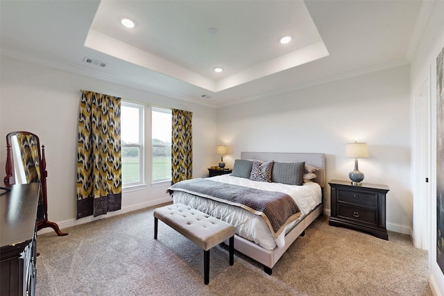 bedroom with light carpet, a water view, a raised ceiling, and ornamental molding