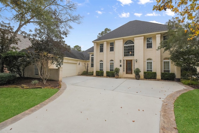 view of front of home featuring a garage and a front yard