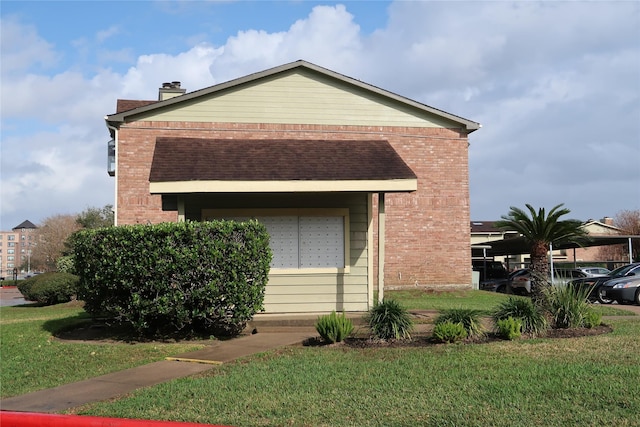 view of side of home featuring mail boxes