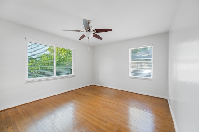 unfurnished room with light hardwood / wood-style flooring and ceiling fan